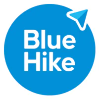 A solid blue circle logo displays the white text "Blue Hike" stacked centrally. A smaller blue navigation pointer icon extends from the circle's top-right edge.